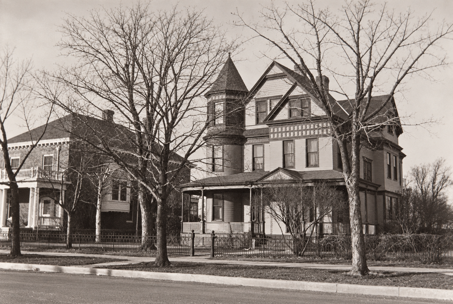 Historic photograph of the Queen Anne house at 618 North Nevada Avenue, with neighboring brick house at left